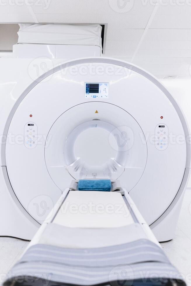Medical CT or MRI or PET Scan Standing in the Modern Hospital Laboratory. CT Scanner in radiography center. MRI machine for magnetic resonance imaging in hospital radiology. Vertical shot photo