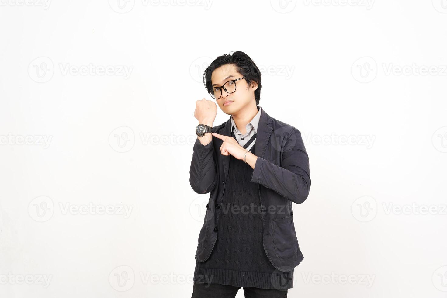 A man in glasses and a sweater is holding a watch photo