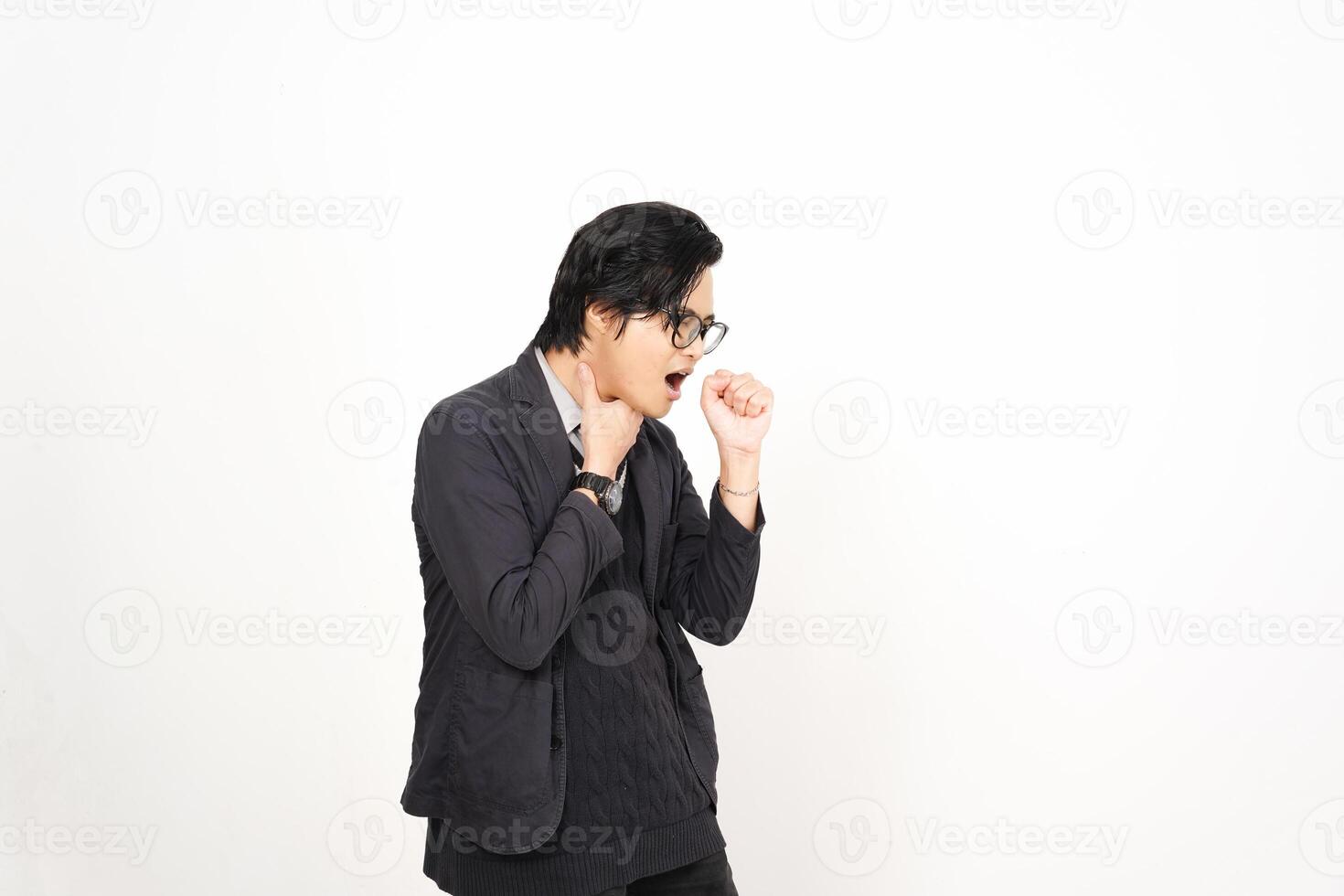 A man in glasses and a jacket is standing in front of a white background photo