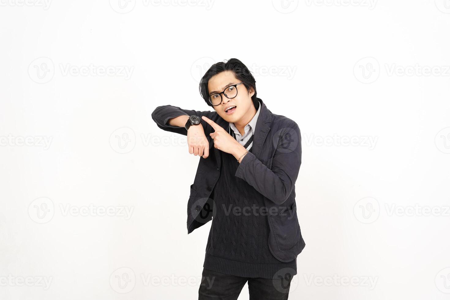 A man in glasses and a jacket pointing at something photo