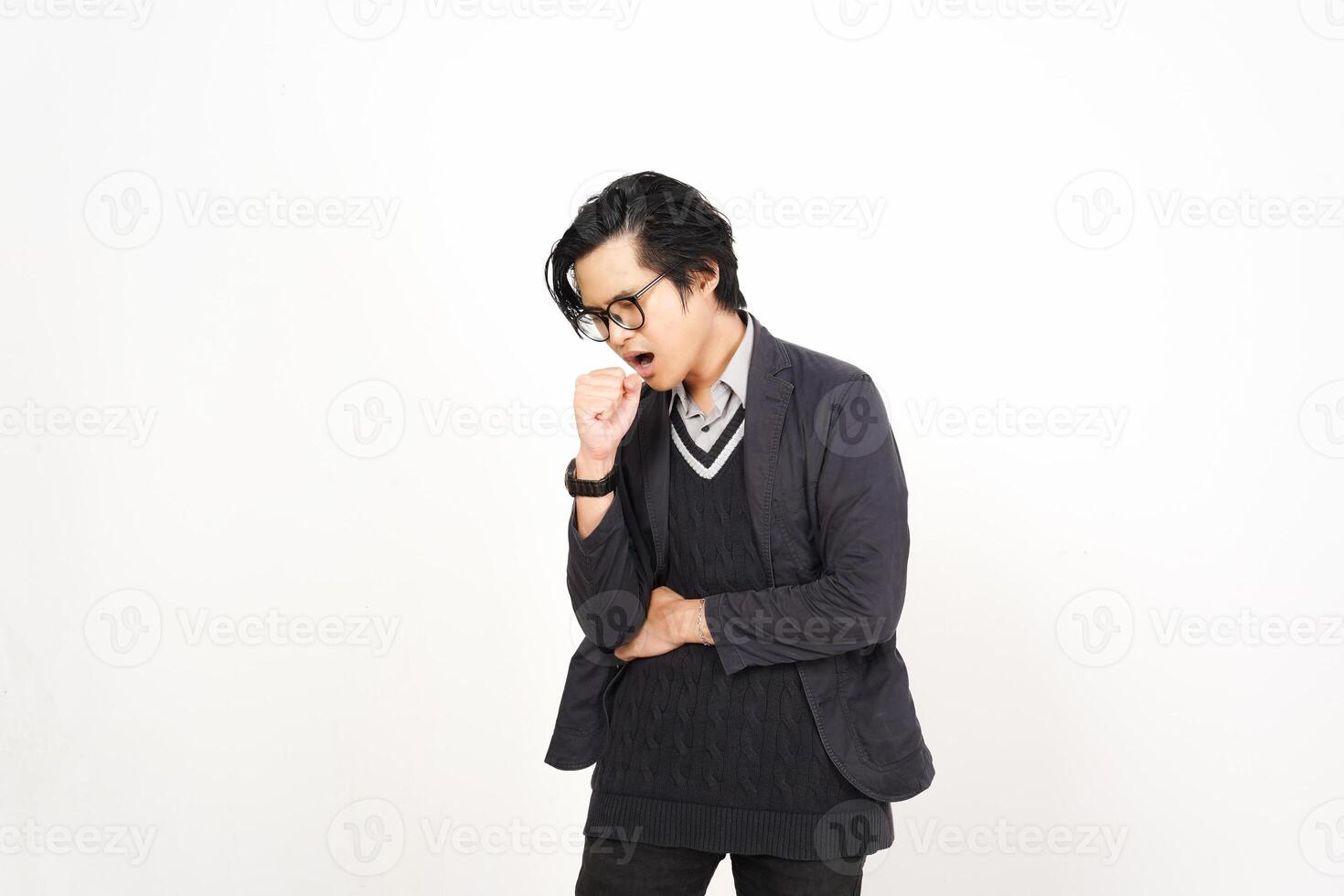 A man in glasses and a sweater is standing in front of a white background photo