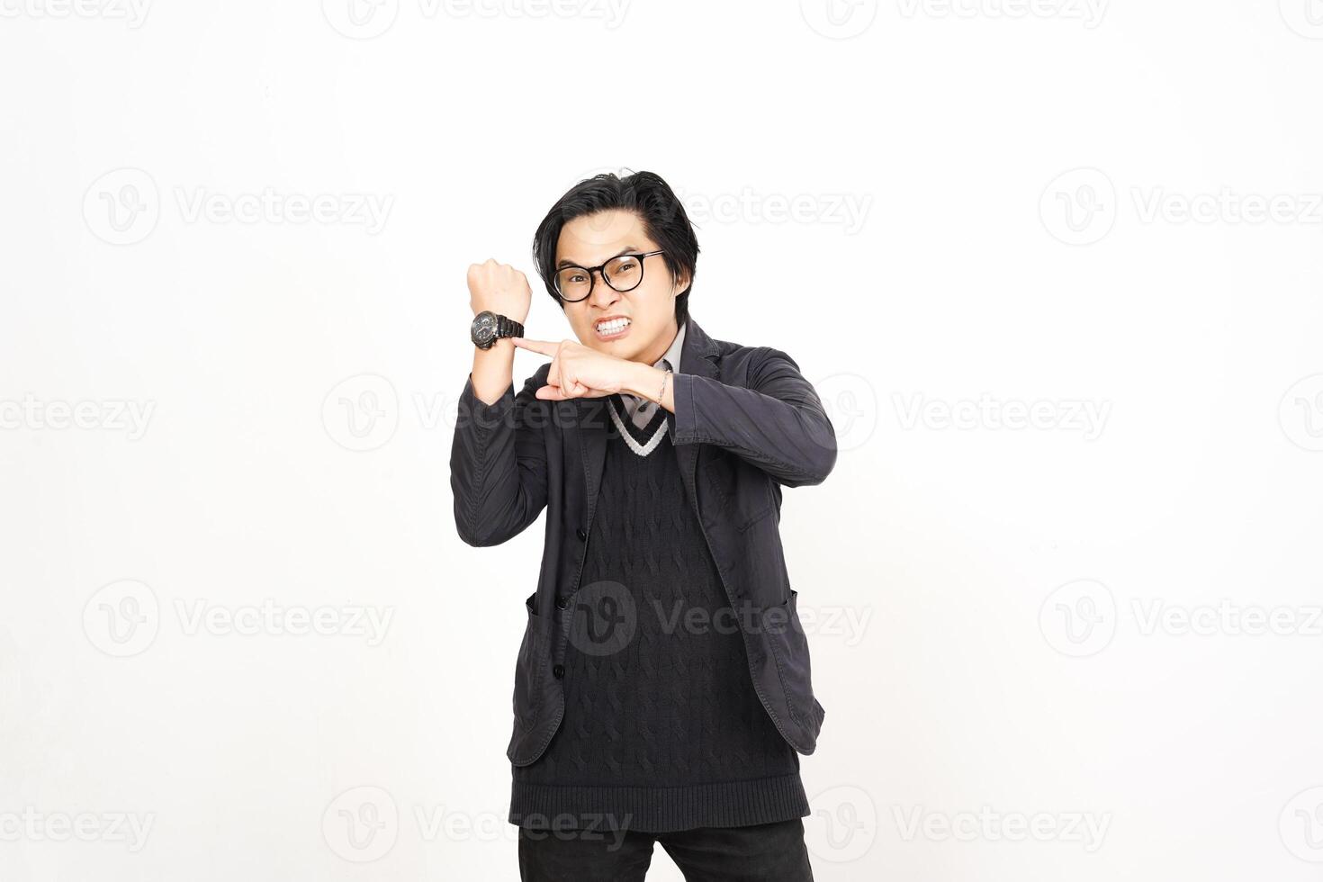 A man in glasses and a black jacket making a gesture photo