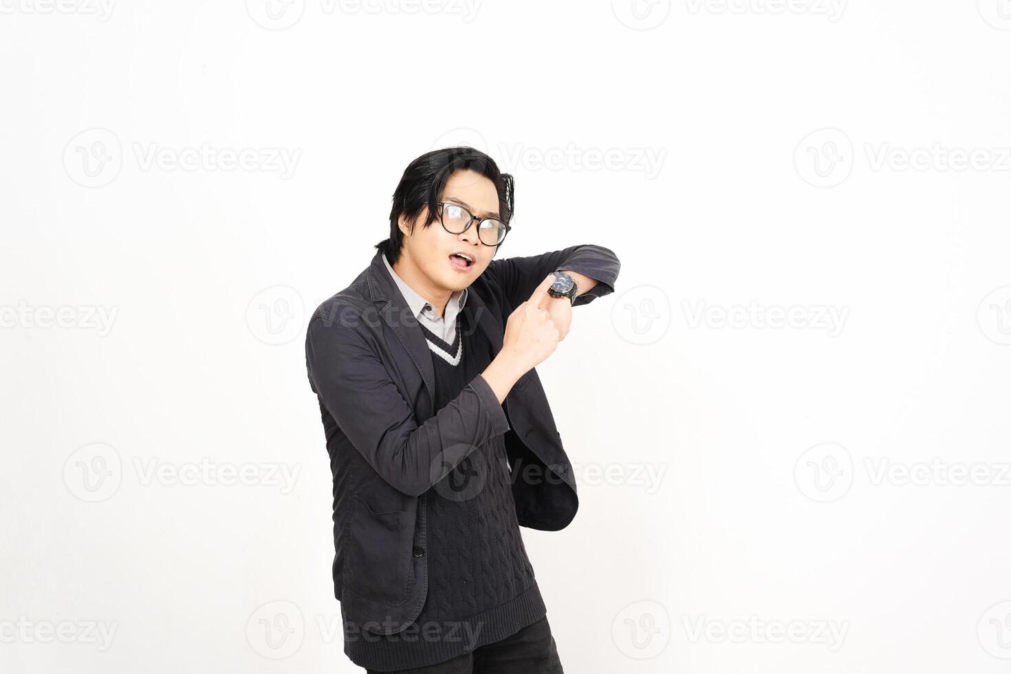 A man in glasses and a sweater is holding his arm up photo