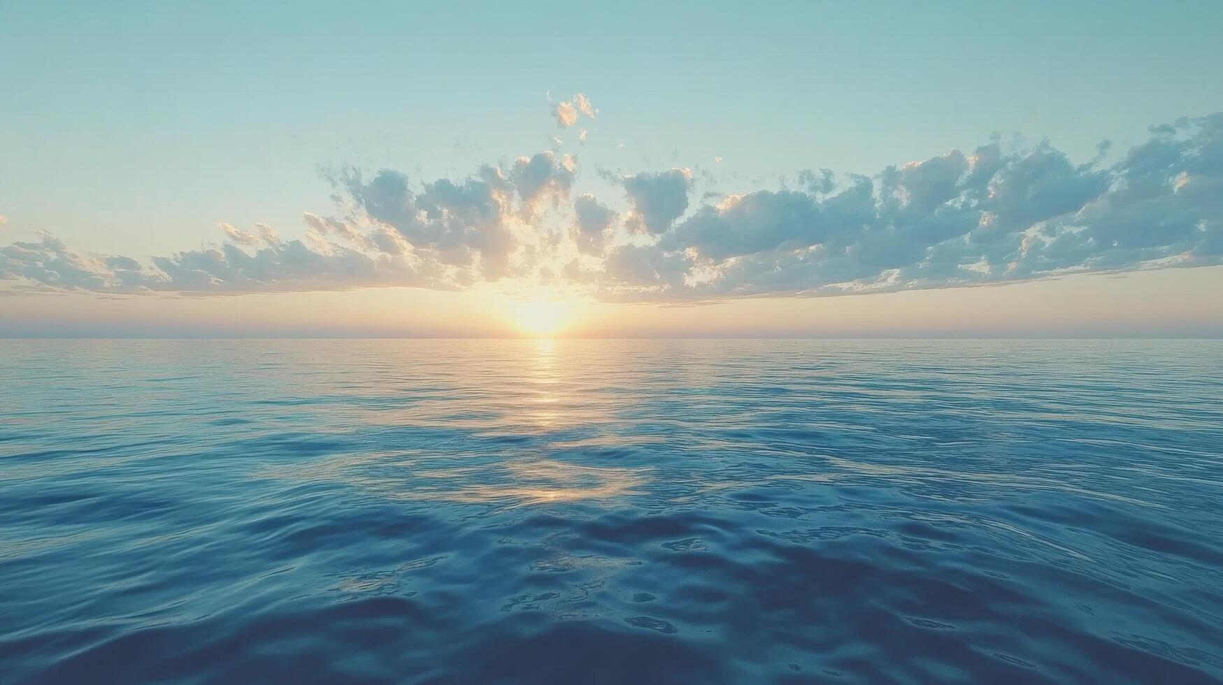 A sunset over the ocean with clouds photo