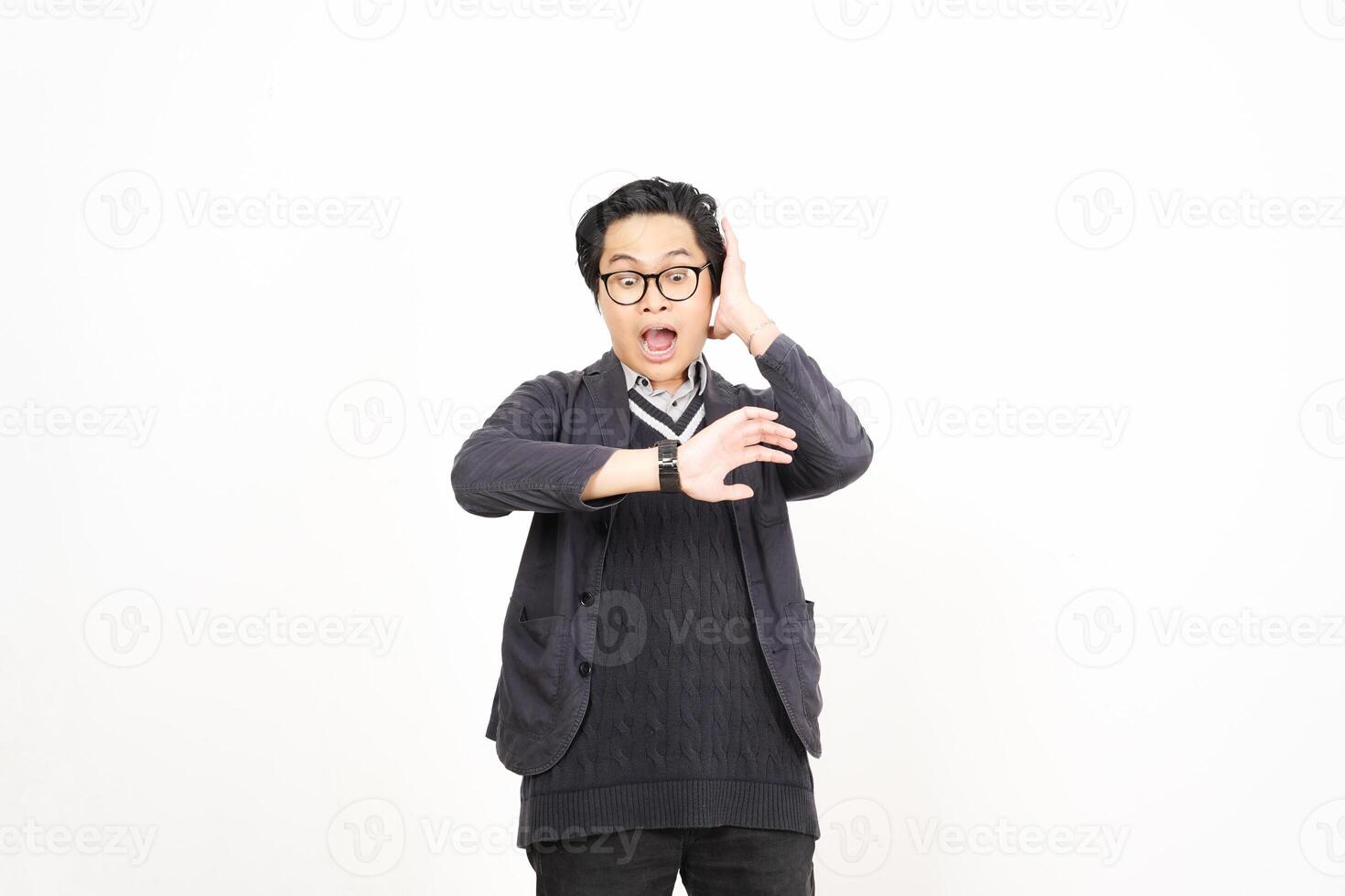A man in glasses and a sweater is making a gesture photo