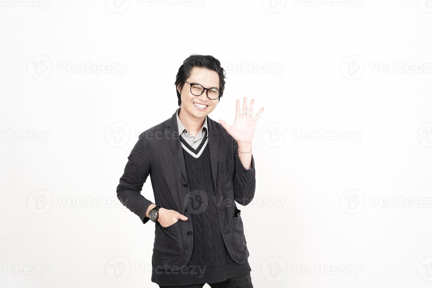 A man in glasses and a sweater is waving photo