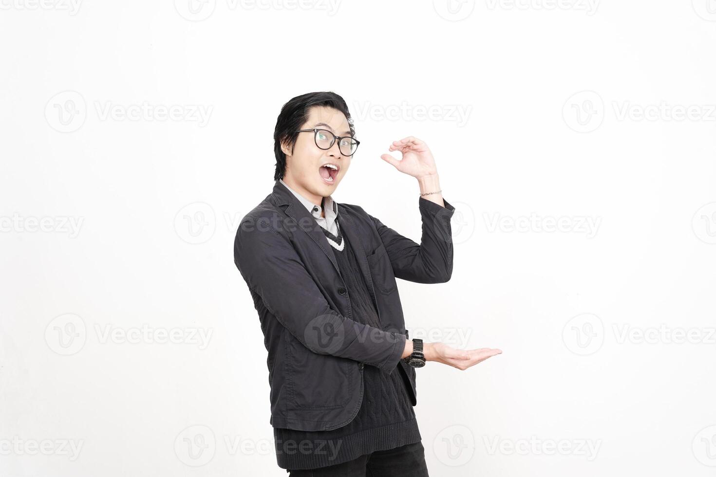 A man in glasses and a jacket is making a gesture photo