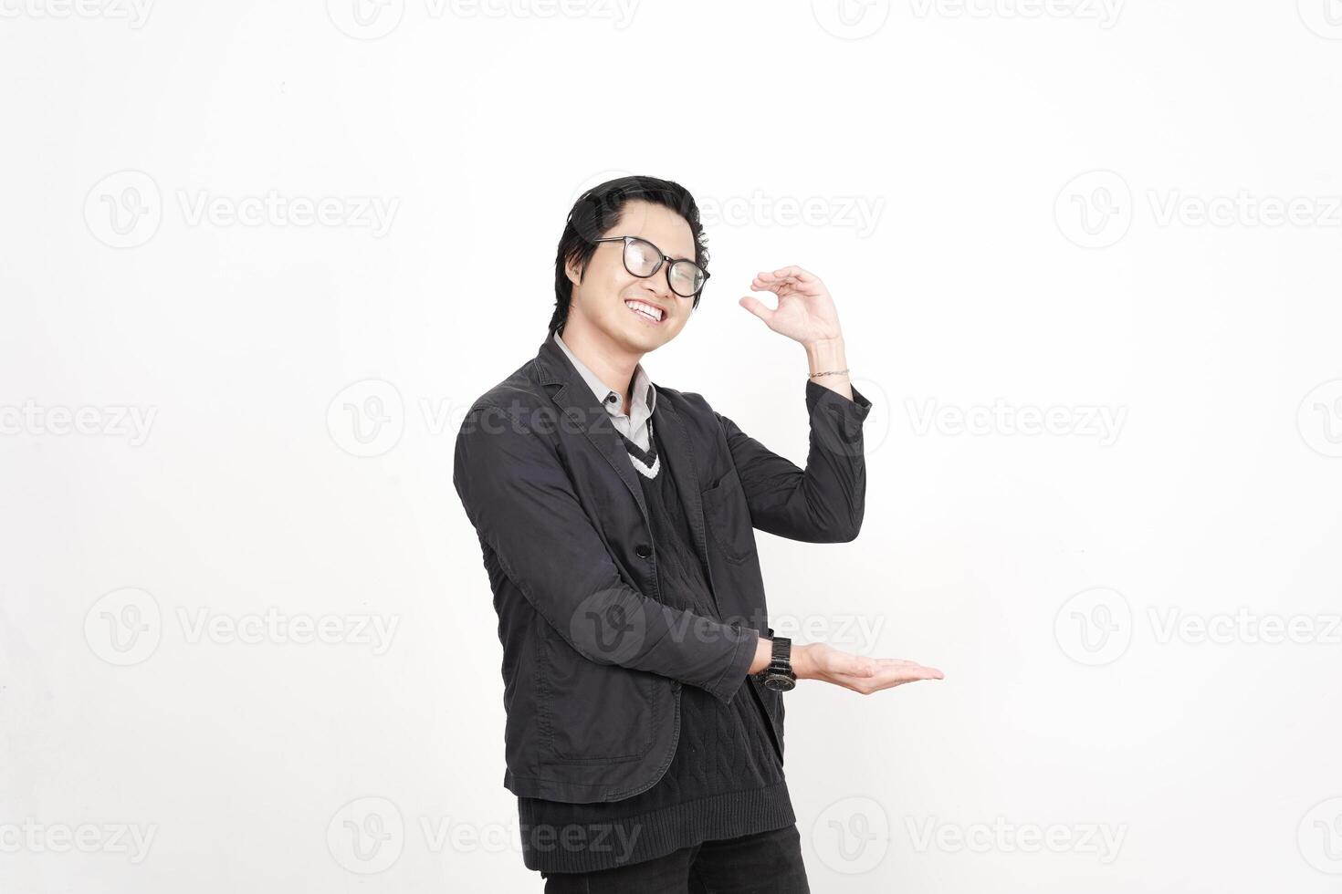 A man in glasses and a black jacket is posing photo