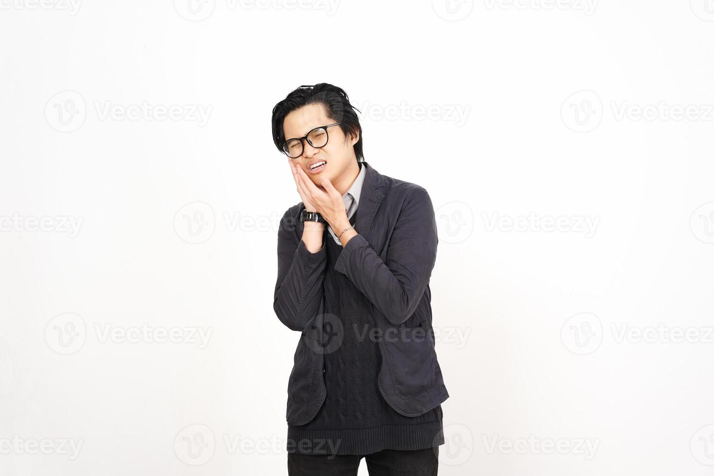 A man in glasses and a sweater standing in front of a white background photo
