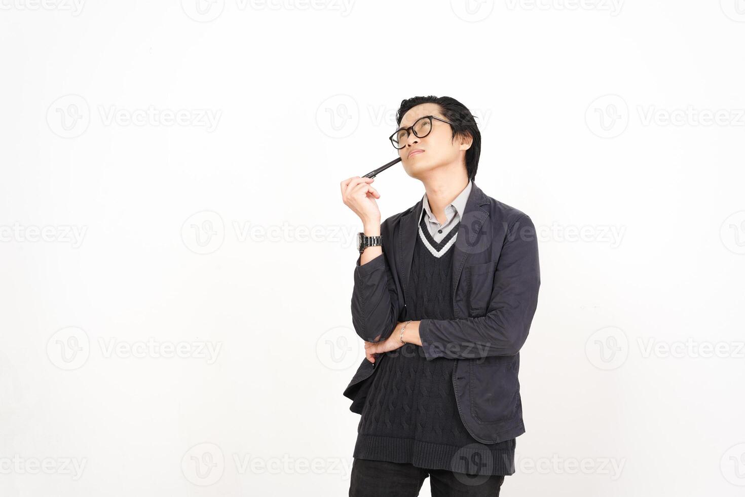 A man in glasses holding a pen photo