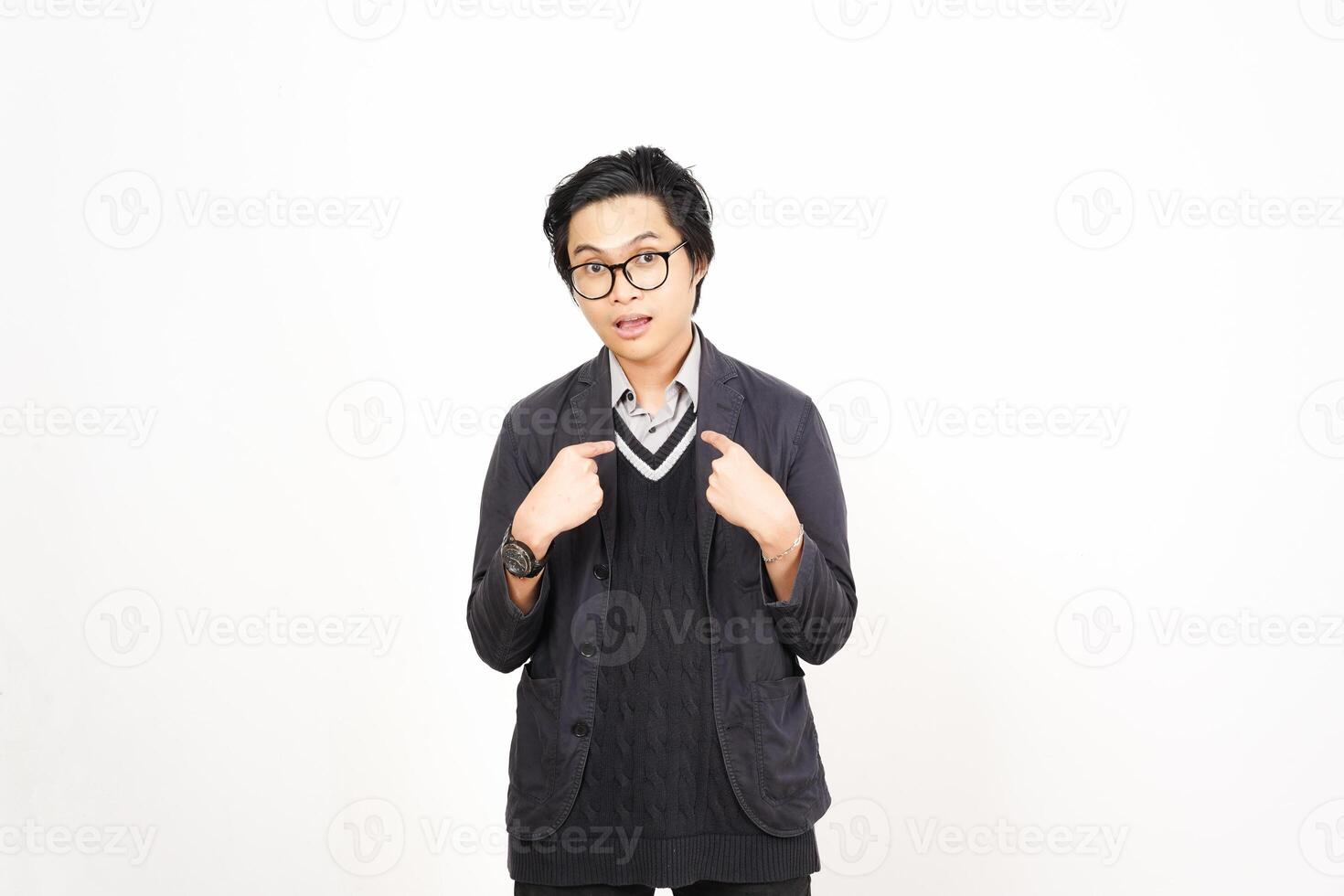 A man in glasses and a sweater standing in front of a white background photo