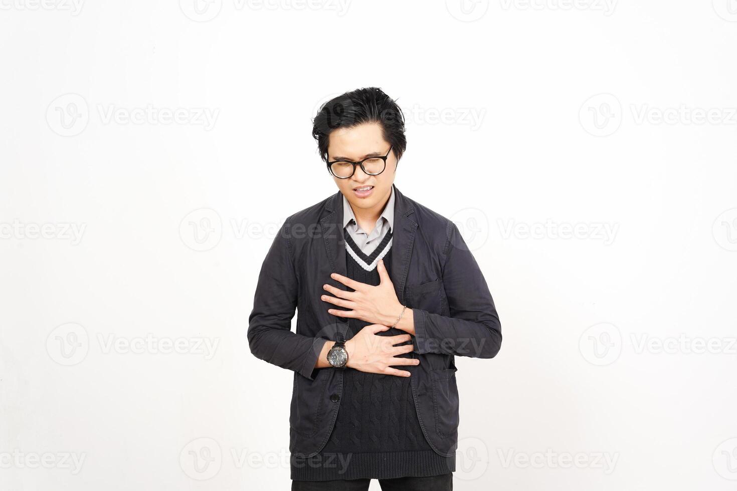 A man in glasses and a sweater is holding his chest photo