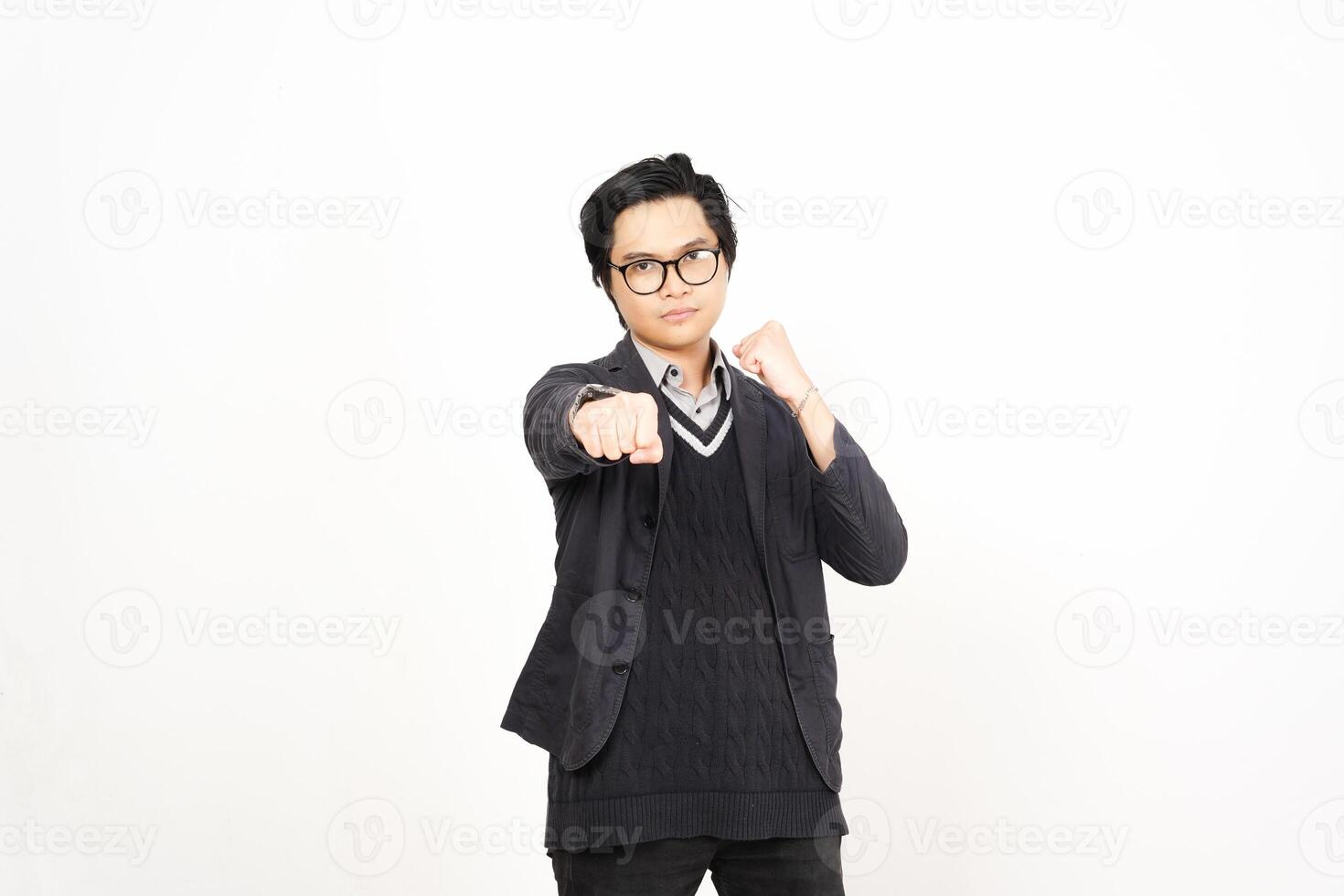 A man in glasses and a sweater pointing at something photo