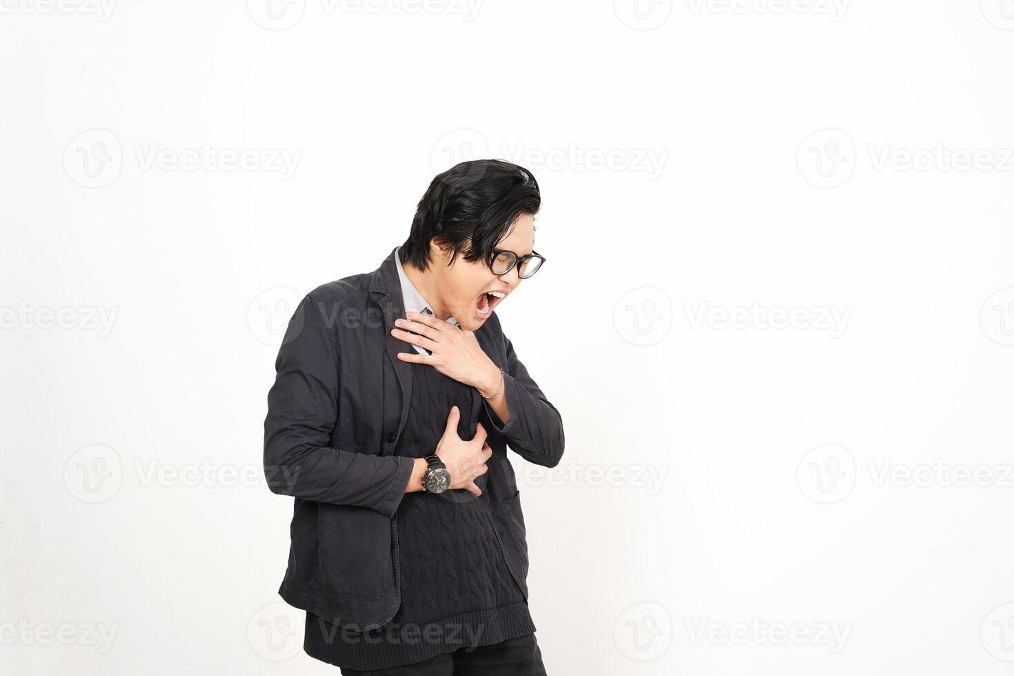 A man with glasses and a black jacket is holding his chest photo