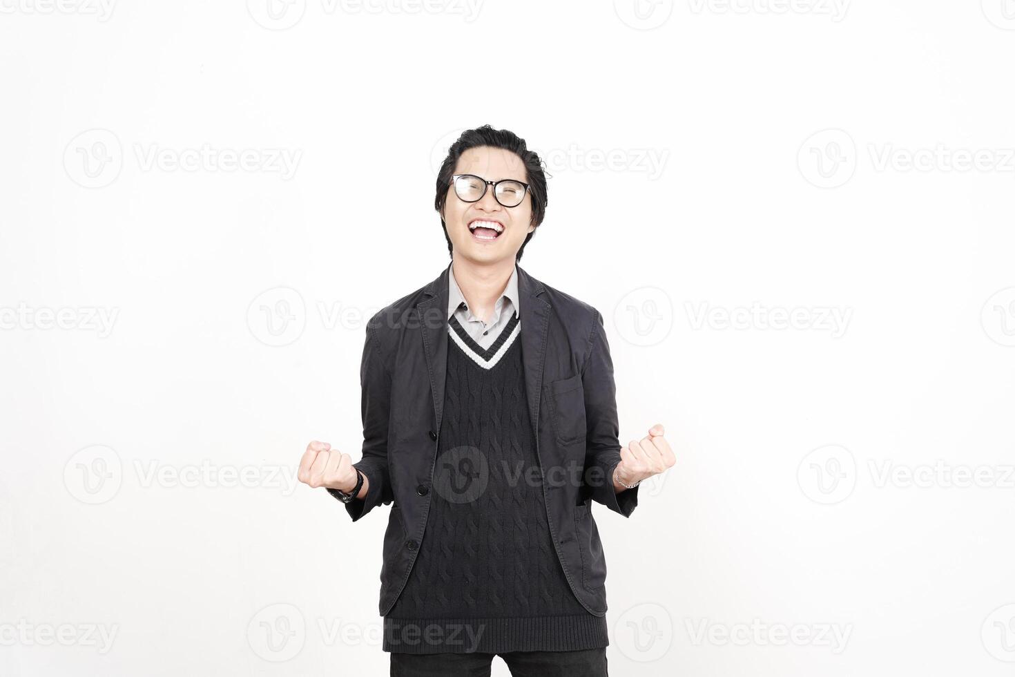 A man in glasses and a sweater is standing photo