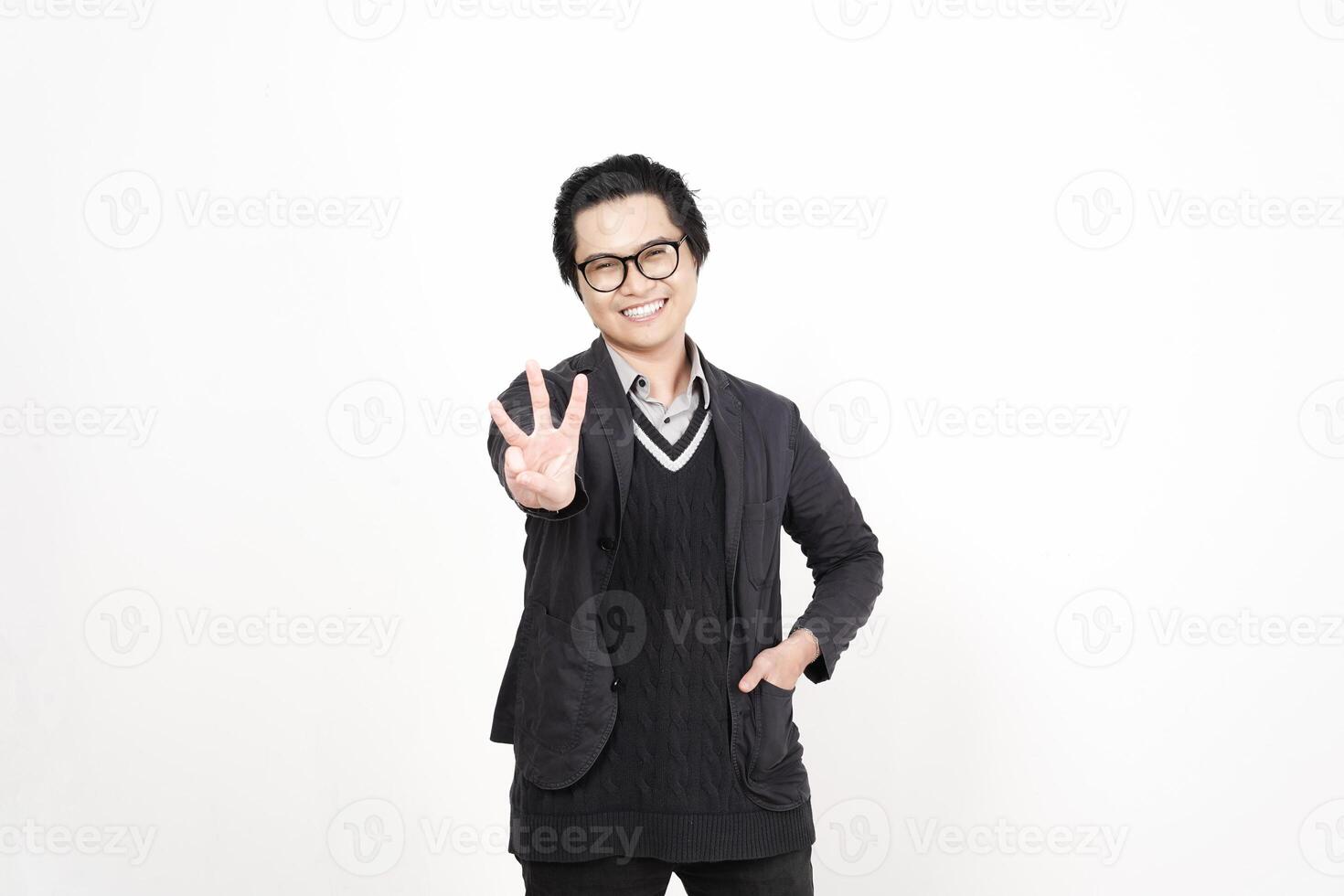 A man in glasses and a sweater is making a peace sign photo