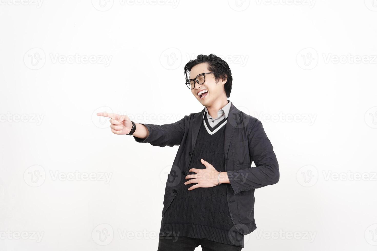 A man in glasses pointing at something photo