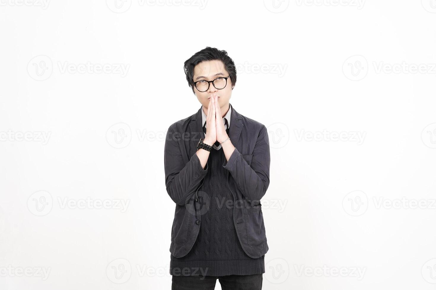A man with glasses and a black jacket is standing photo