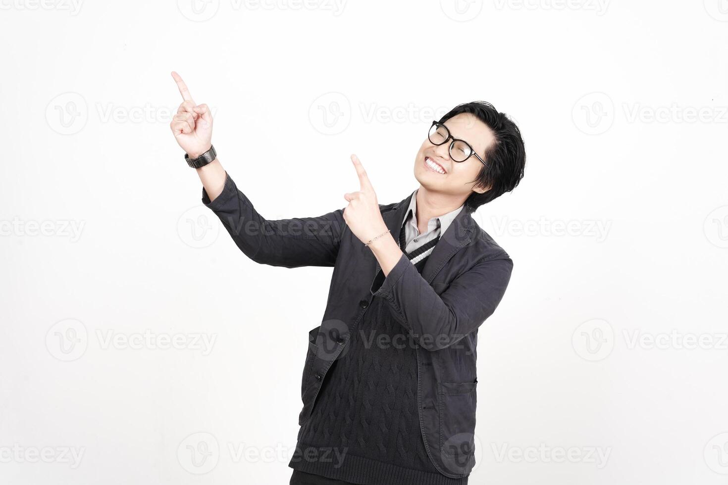 A man in glasses pointing up at something photo