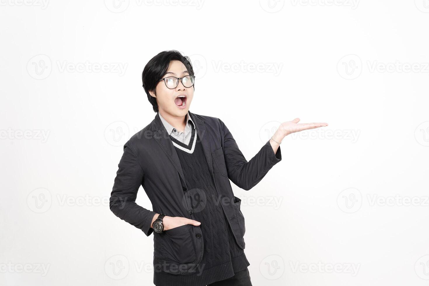 A man in glasses and a jacket is holding something photo