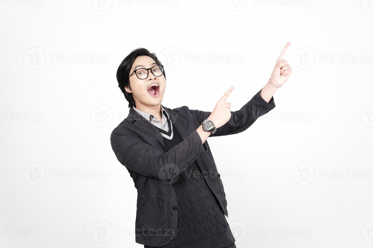 A man in glasses pointing up with his hand photo