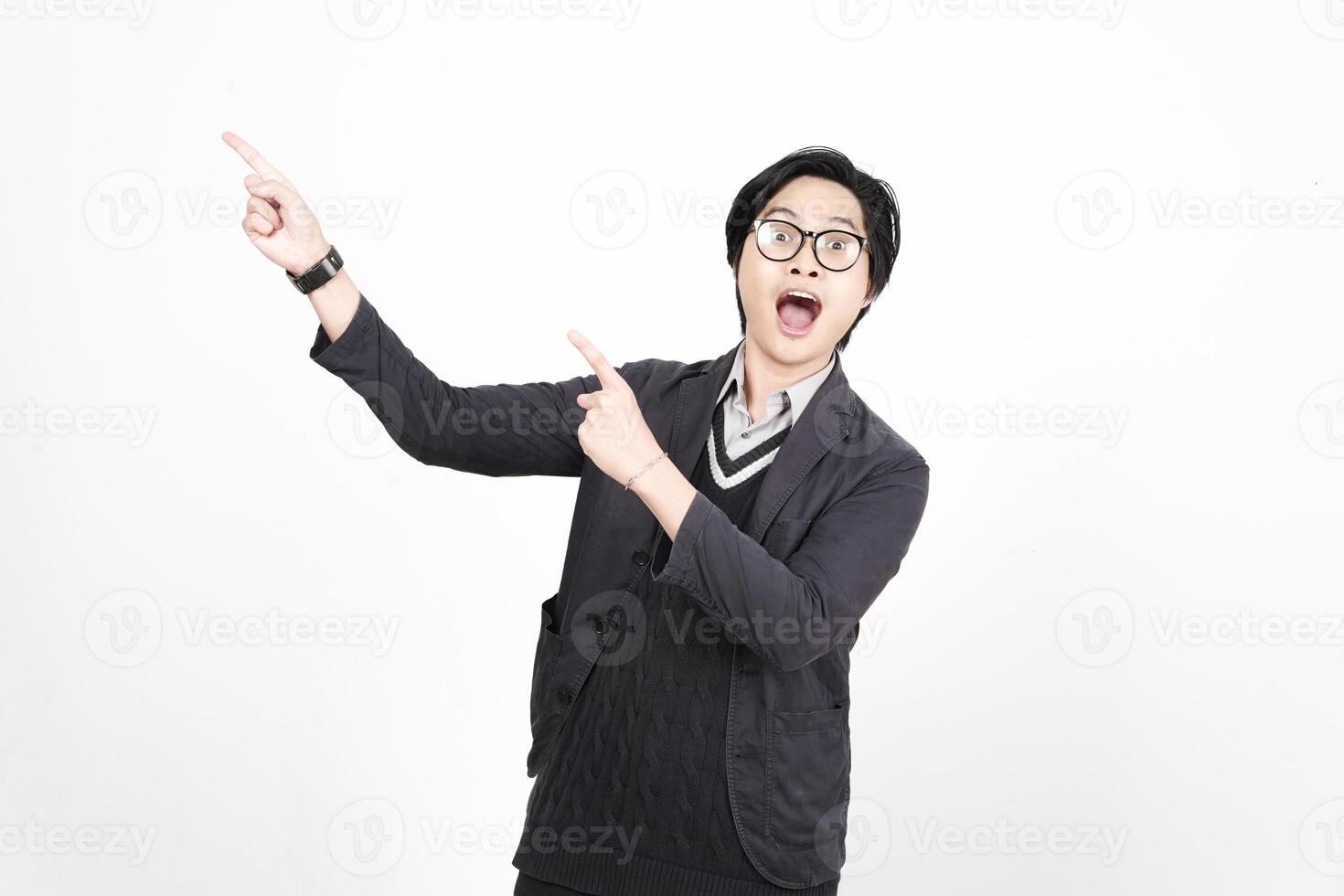 A man in glasses and a sweater pointing at something photo