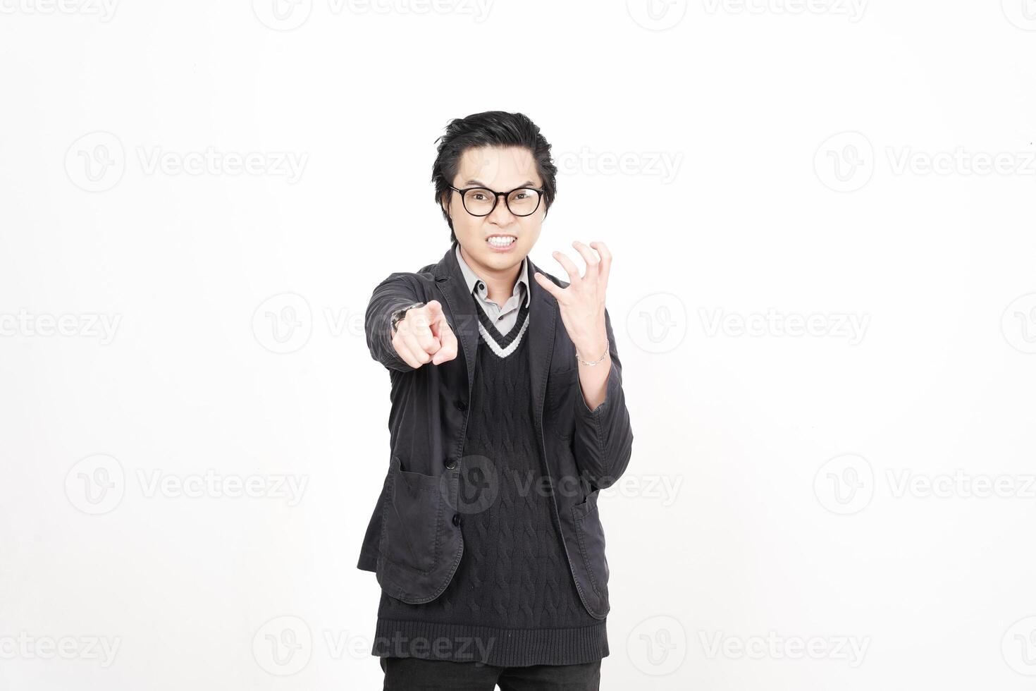 A man in glasses and a sweater pointing at something photo