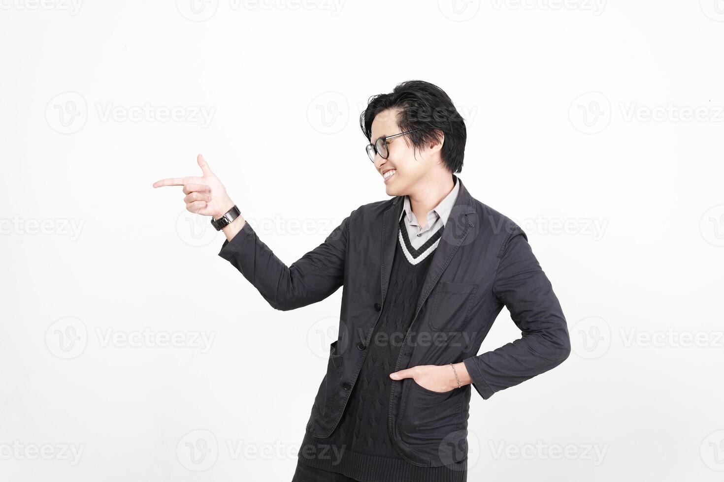 A man in glasses pointing at something photo