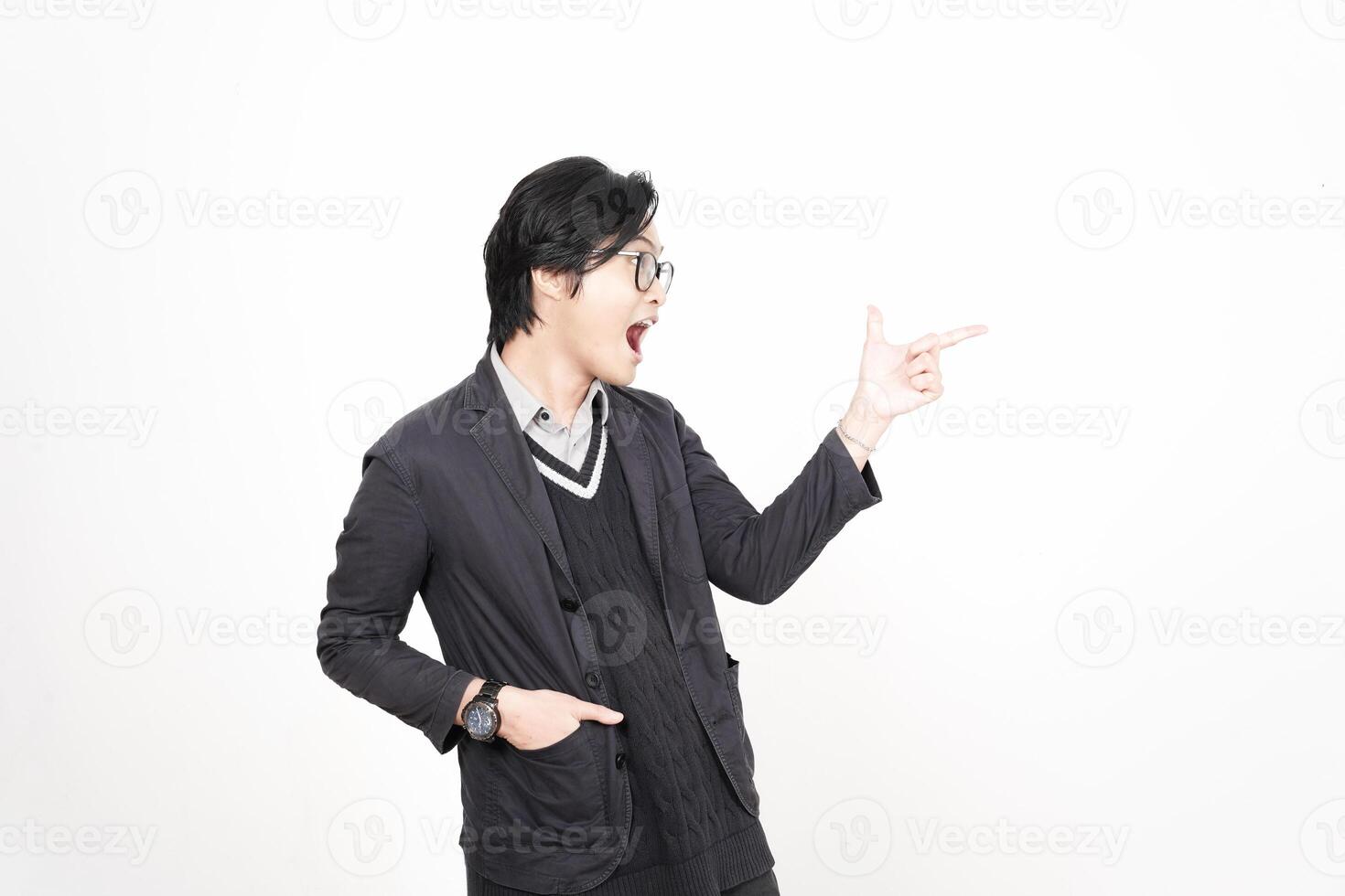 A man in glasses pointing at something photo