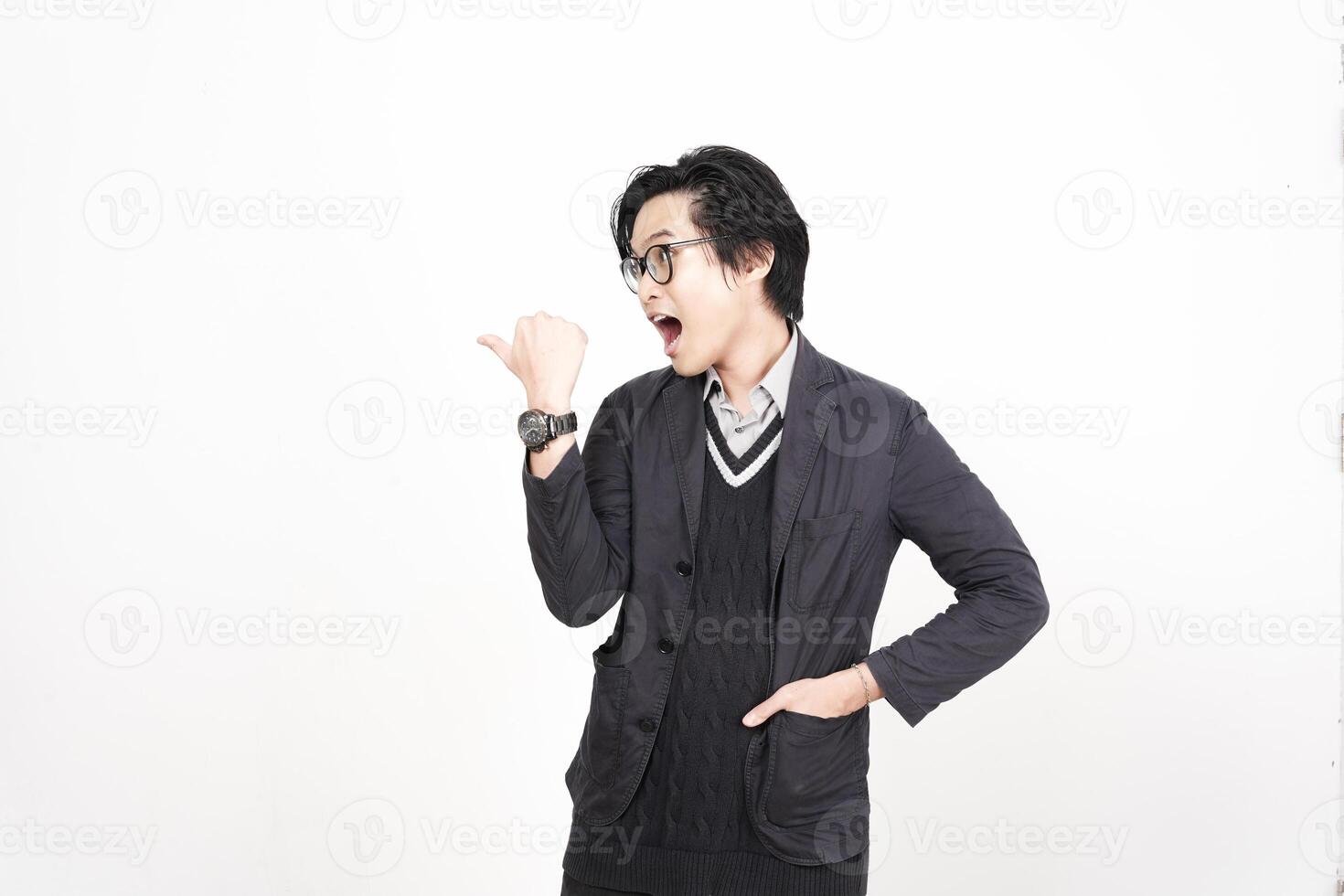 A man in glasses and a jacket is making a gesture photo