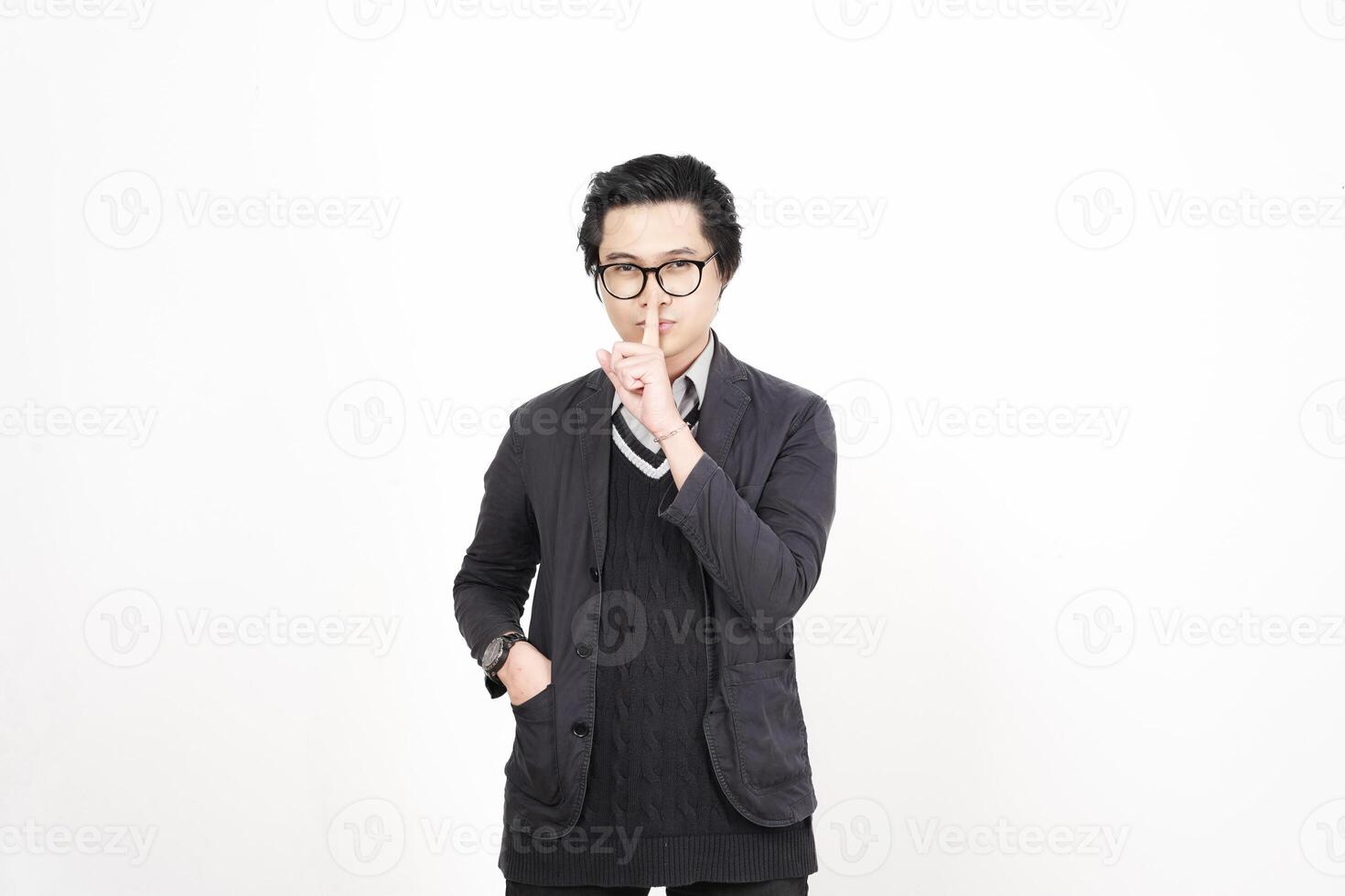 A man in glasses and a sweater is making a gesture photo