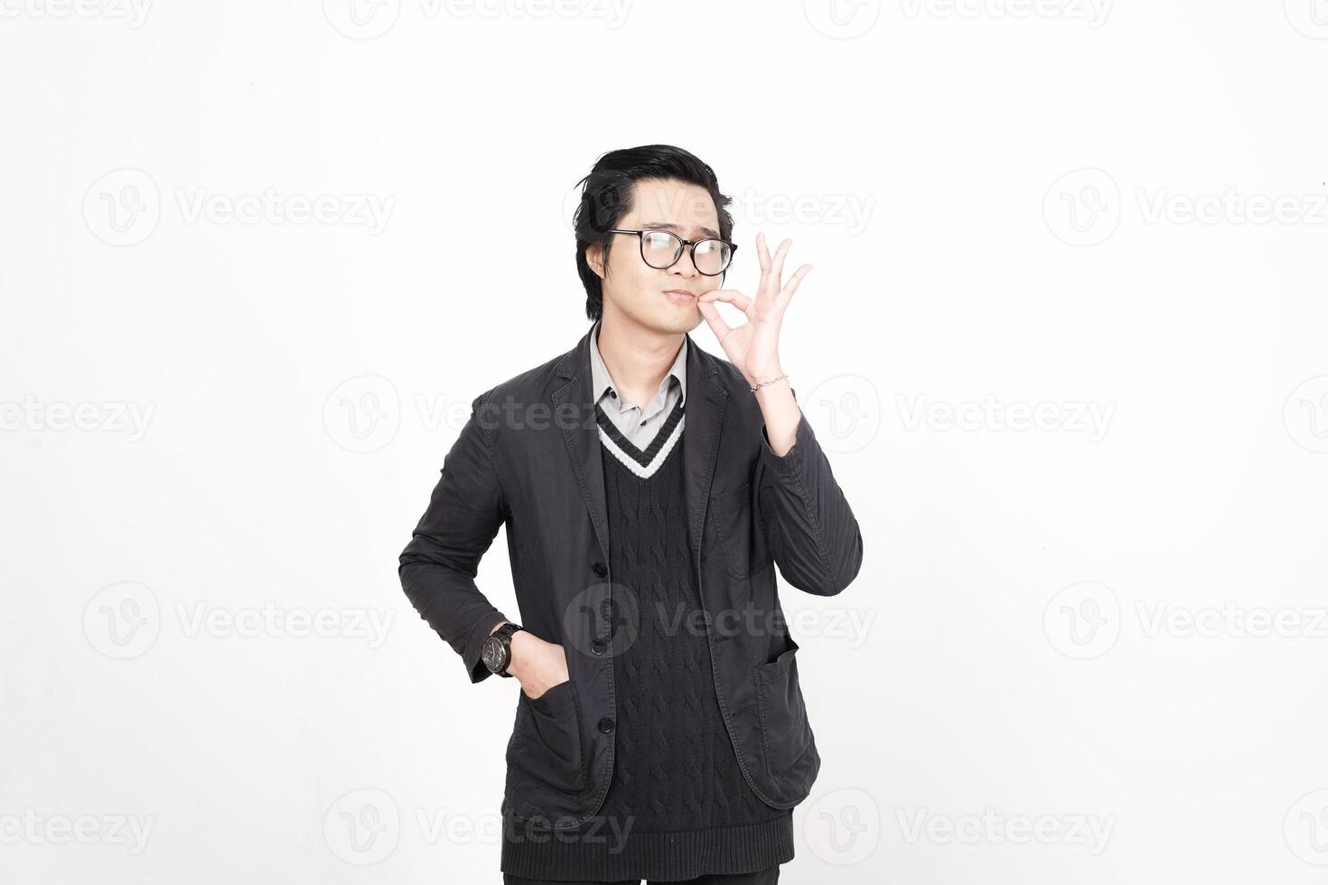 A man in glasses and a sweater is making a peace sign photo
