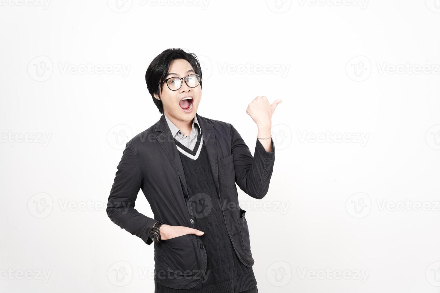 A man in glasses and a jacket is pointing his finger photo