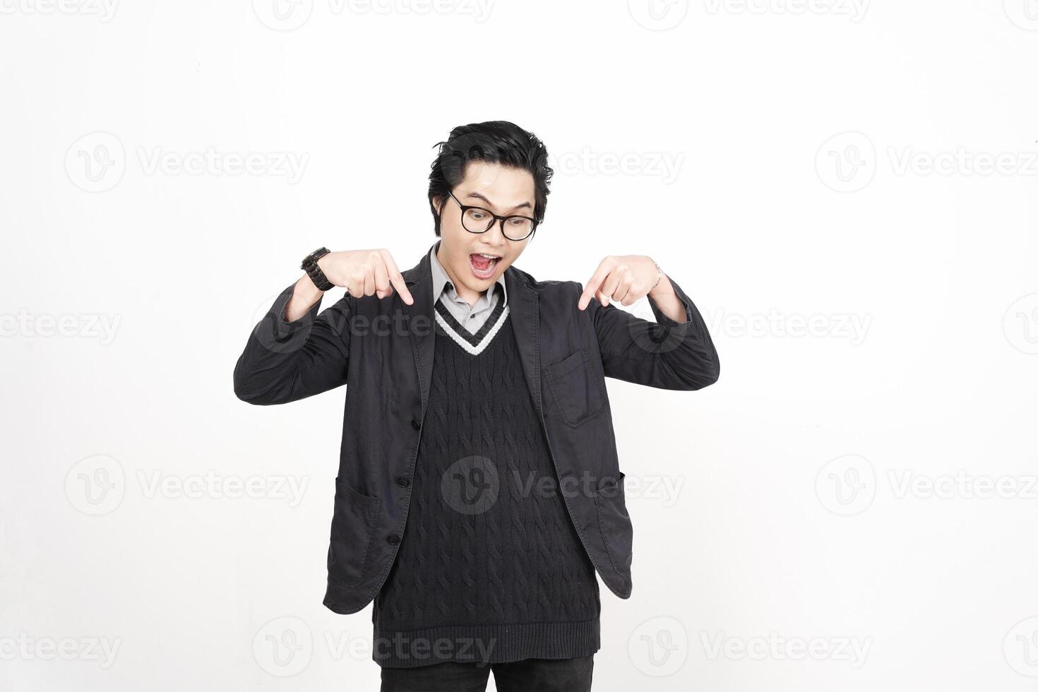 A man in glasses and a sweater is making a gesture photo