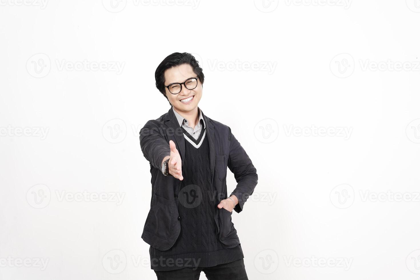 Asian man in glasses and sweater pointing to the camera photo