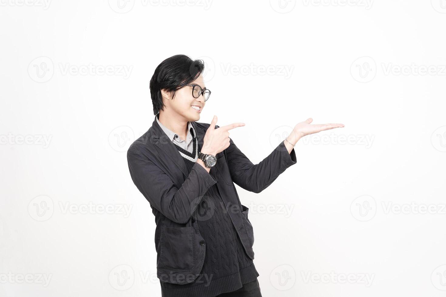 A man in glasses pointing at something photo