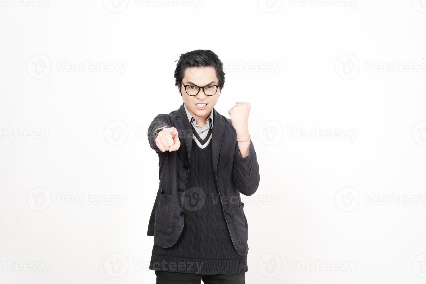 A man in glasses and a sweater pointing at something photo