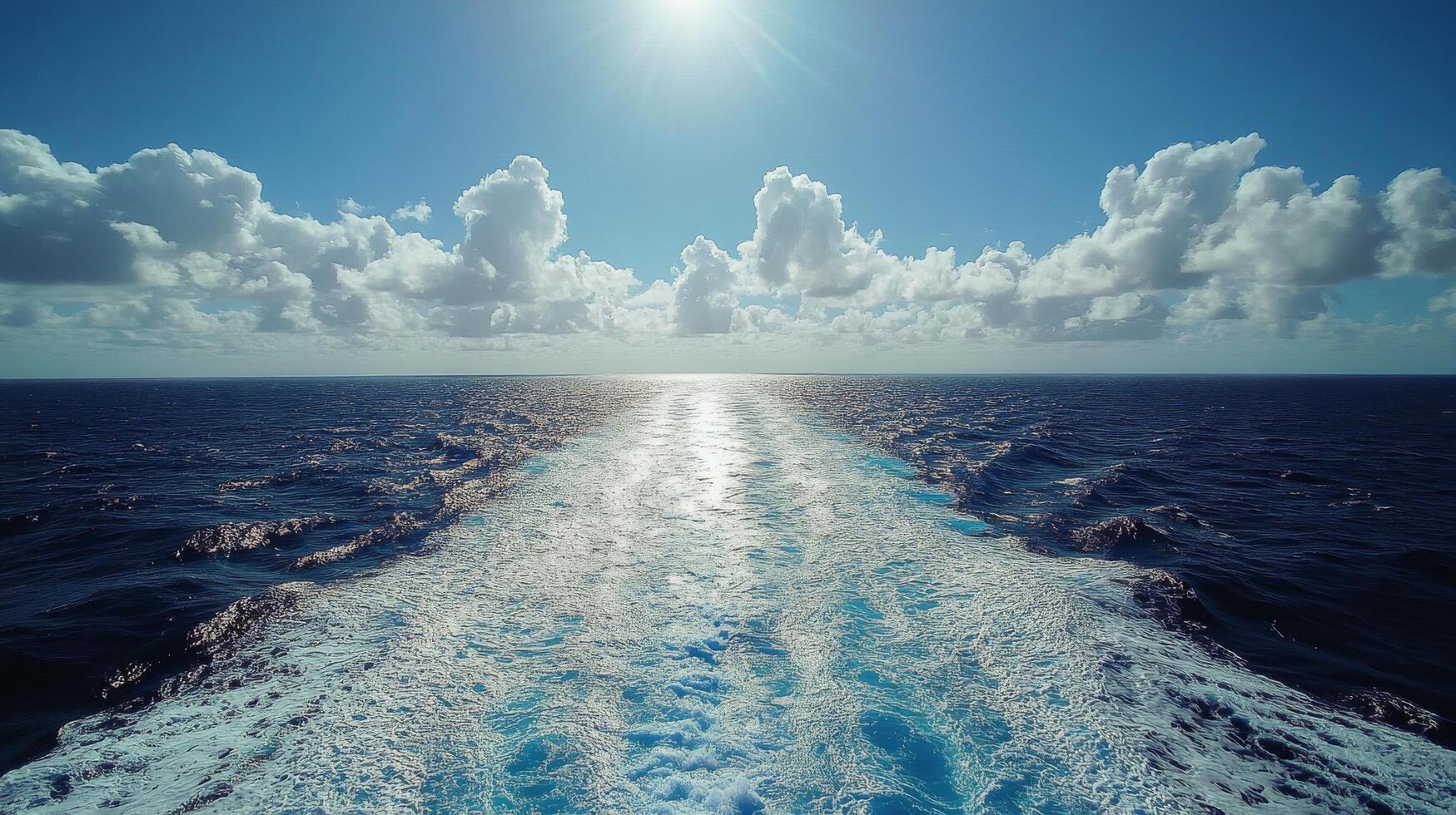The sun shines on the ocean as it travels through the water photo