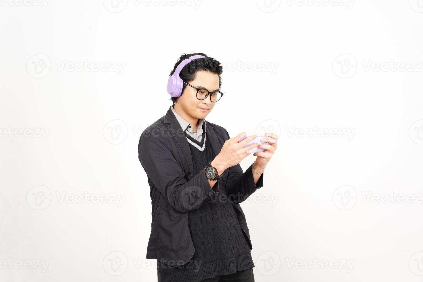 A man wearing headphones and holding a cup photo