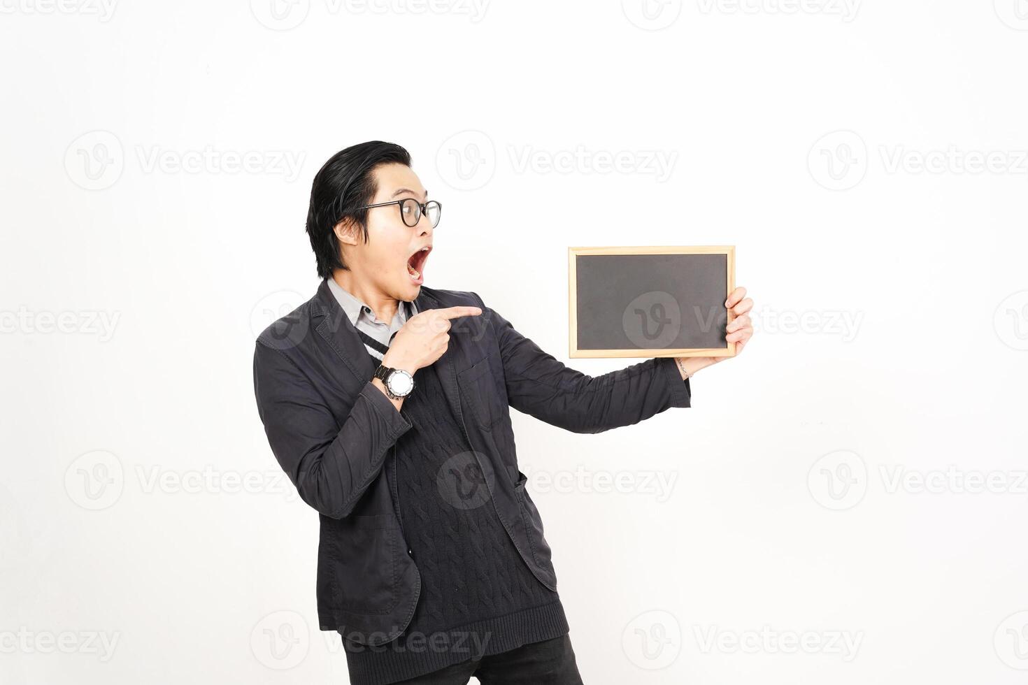 A man holding a blackboard and pointing at it photo