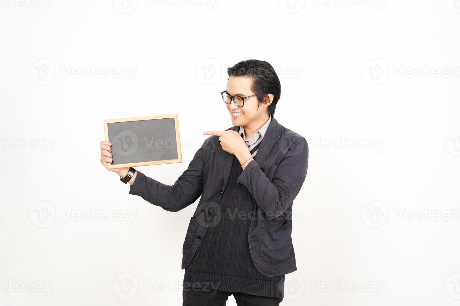 A man holding a chalkboard and pointing to it photo