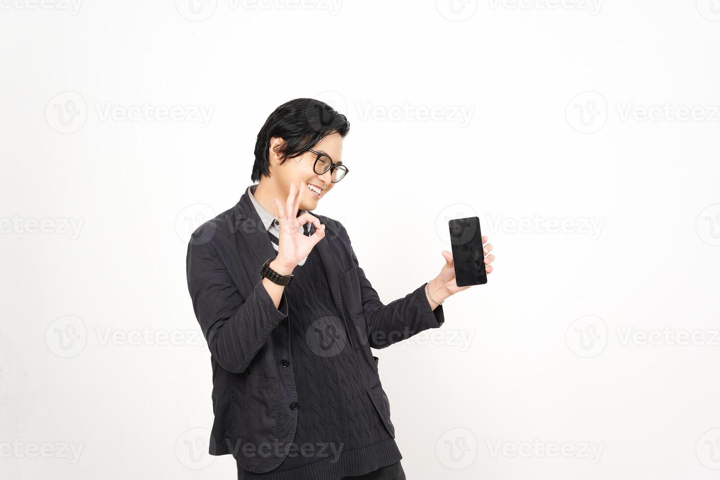 A man in glasses holding a cell phone photo