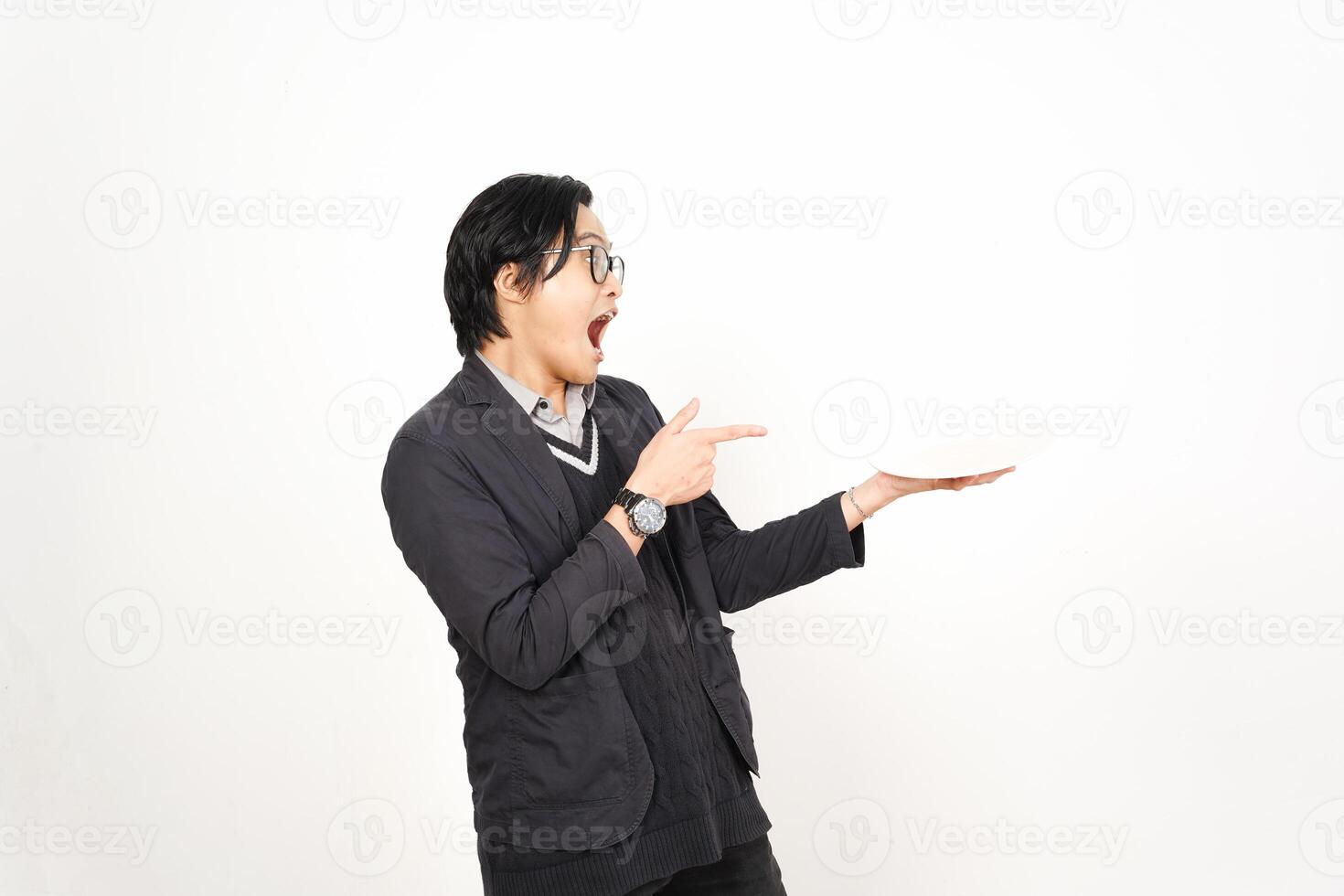 A man holding a plate with his hand photo