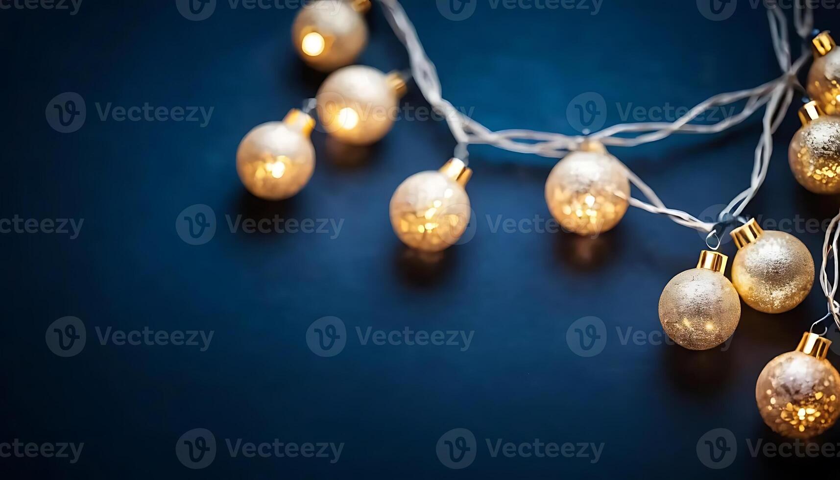 Festive Christmas Garland with Sparkling Bokeh Lights on Dark Blue Background. Perfect for Holiday photo