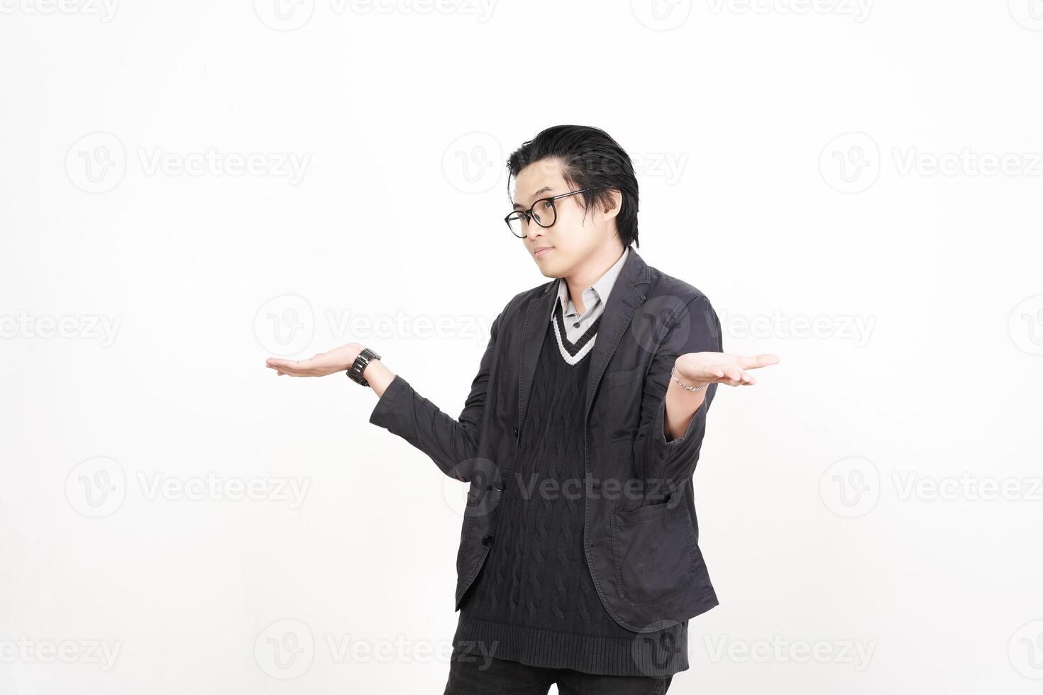 A man in glasses and a sweater is standing with his hands out photo