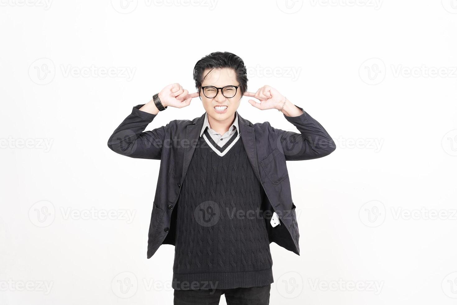 A man in glasses and a sweater is making a face photo