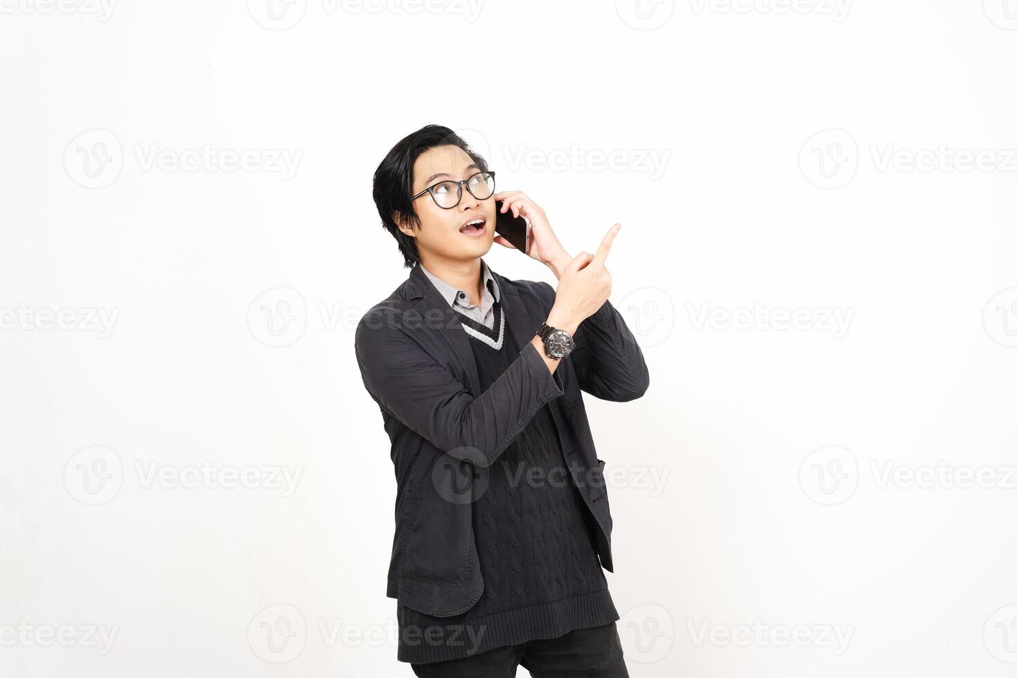 A man in glasses and a sweater is talking on a cell phone photo