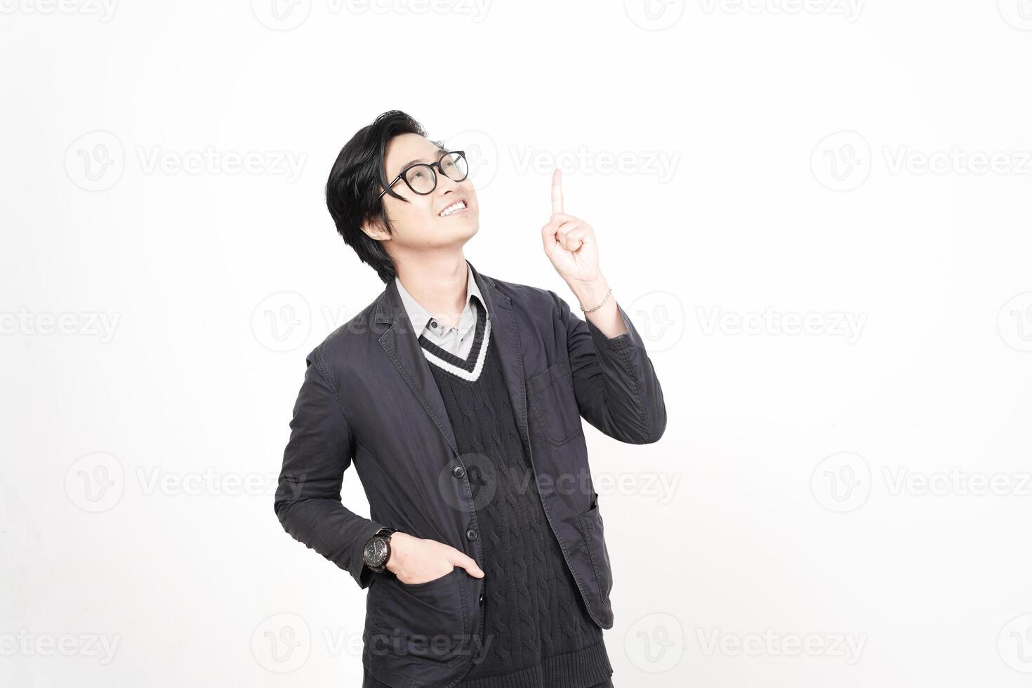A man in glasses pointing up photo