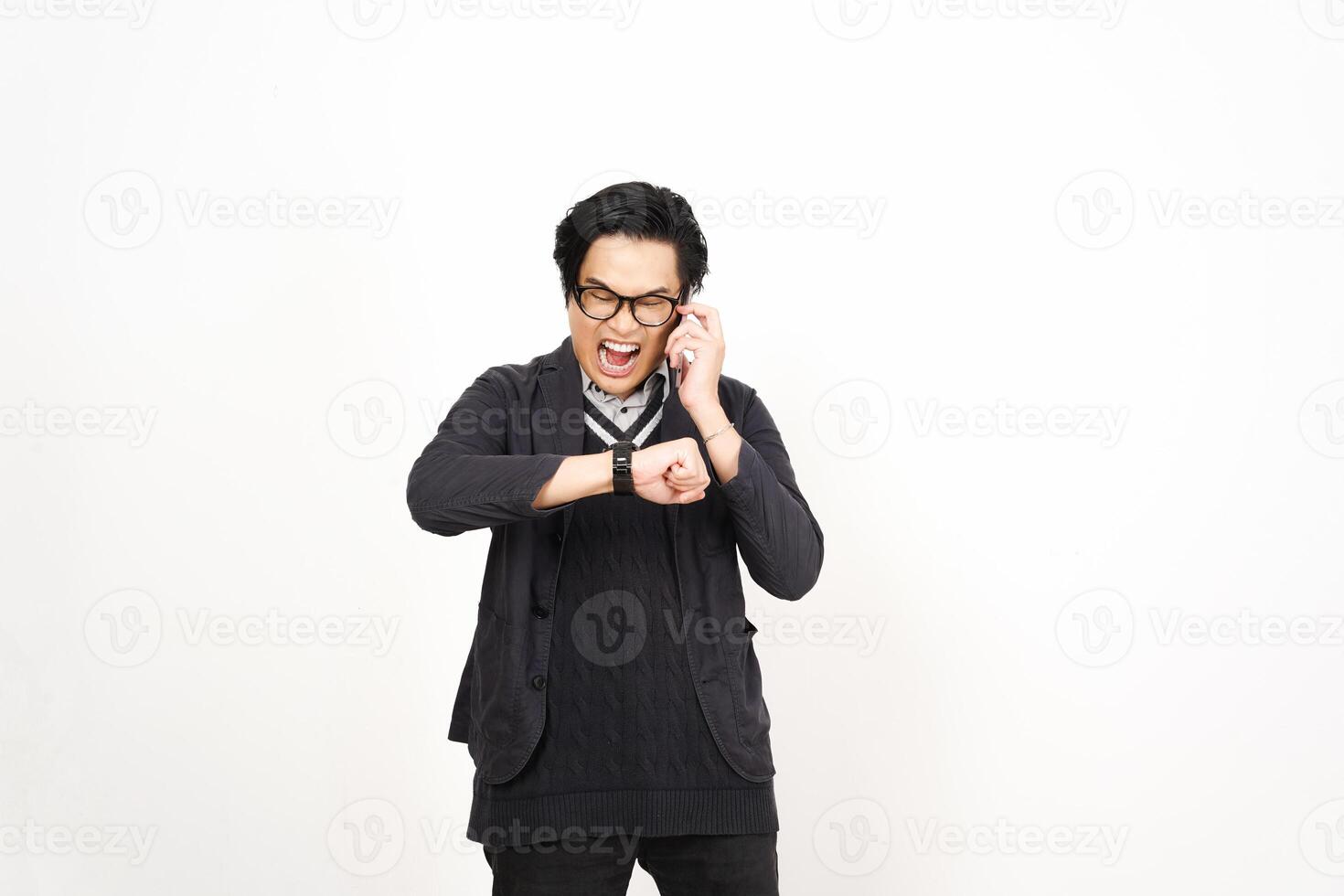 A man in glasses and a sweater is holding his phone photo