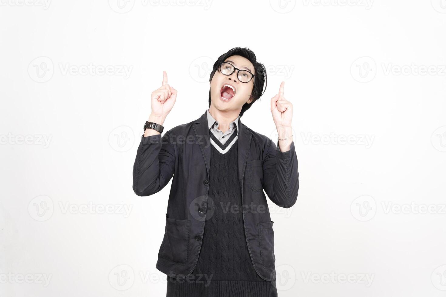 A man in glasses and a black jacket is making a gesture photo